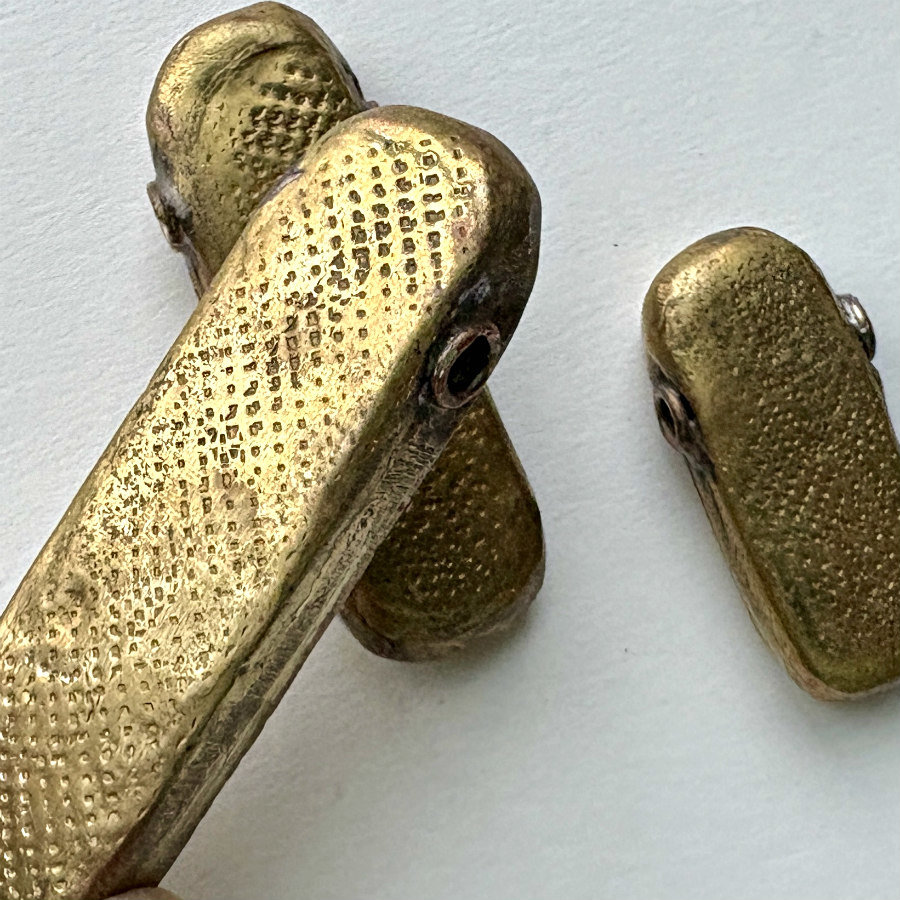 African Debossed-Metal Hollow Pendants: Trio 2